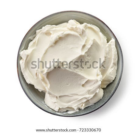 Bowl of cream cheese isolated on white background, top view Royalty-Free Stock Photo #723330670