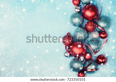 Christmas decoration on blue snowy background with copy space.