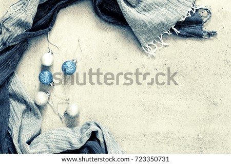 Christmas composition. Christmas decorations, shiny balls on a gray stone background. Toned photo. Flat lay, top view, space for text