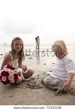 beach wedding with children of bride and groom on beach in Thailand