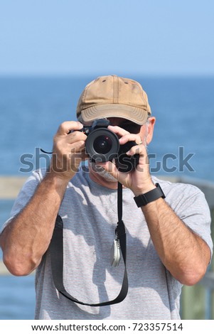 Senior Man with Camera on Boardwalk (Irving Eco-centre, la Dune de Bouctouche)

