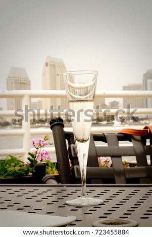 Glass of champagne with a city view 