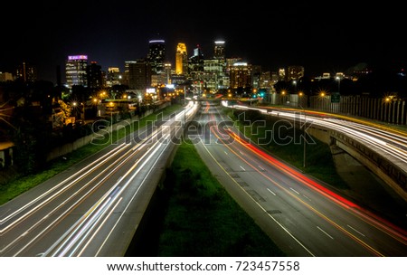 Traffic races through the Minneapolis skyline.