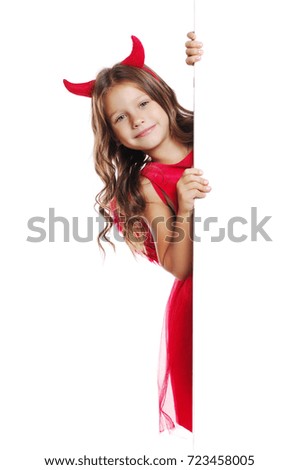 Closeup picture of a girl in a  halloween fancy dress  looking out from the blank