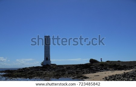 Das Conchas beach lighthouse during low tide, itacare, ba, brazil