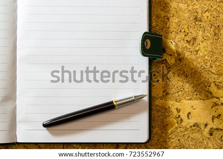 Pen and paper. A textured background. Copy paste place