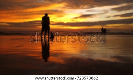abstract blur image of sunset at beach as background purpose