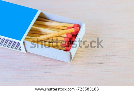 match stick in box  with red head concept energy old vintage on wooden floor background with copy space add text  ( high definition image )