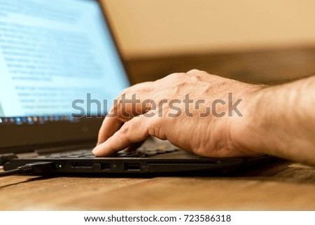 Hands on keyboard of a computer