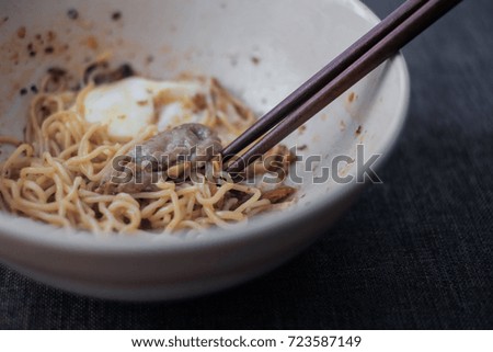 A bowl of egg noodle with sliced of boiled pork on background, Traditional Thai food recipe, Popular street food in Thailand.