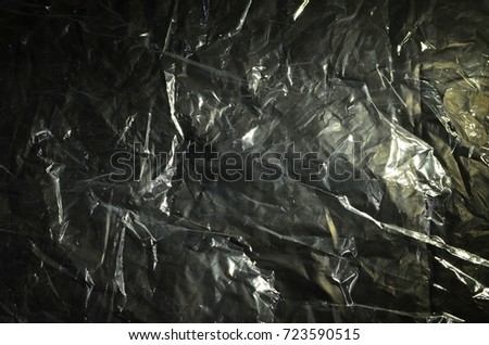 Close up photo of plastic bag, light shine on the surface, create abstract image.