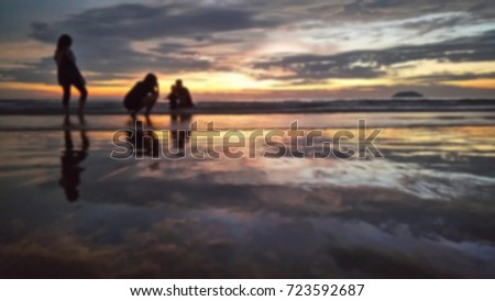 abstract blur image of sunset at beach as background purpose