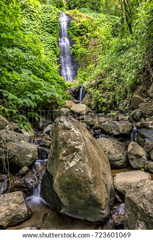View of waterfall with stones on Bali