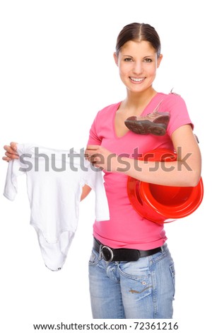 Full isolated studio picture from a young girl with baby clothes