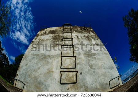 The concrete building and the blue sky 