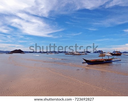 Beautiful landscape with blue sky, mountain, sea and fishing boat at El Nido beach in Palawan island, Philippines
