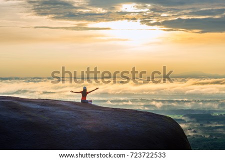 Woman Opens Her Arm, Enjoy the Fresh Air and Embrace the Nature on the three whale rock mountain at Phu Sing , Bueng Kan Province,Thailand
 Royalty-Free Stock Photo #723722533