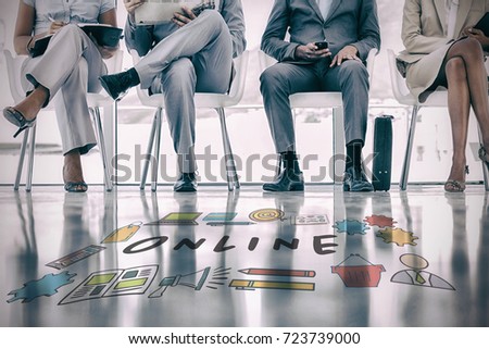 Online text surrounded by various icons against low section of business people waiting