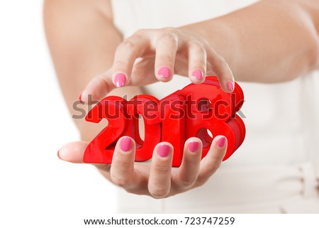 Two Woman Hands Protecting 2018 New Year Sign on a white background.