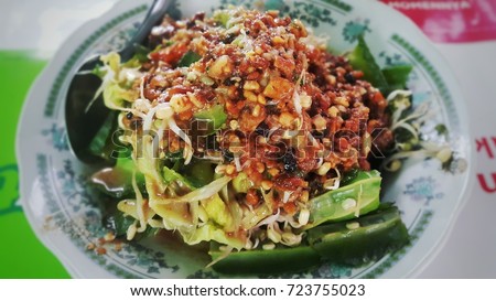 Pecel. Traditional Javanese Salad from Indonesia consisting mix vegetables with peanut sauce. Taken in Yogyakarta August 2017. You can found This food in every traditional market called Pecel.  Royalty-Free Stock Photo #723755023