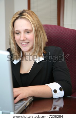Woman on the computer at work in an office