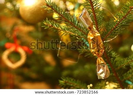 Photo of christmas tree in evening with lights on