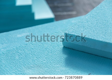 XPS polystyrene insulation boards closeup stacked on the floor . Energy savings minimal concept Royalty-Free Stock Photo #723870889