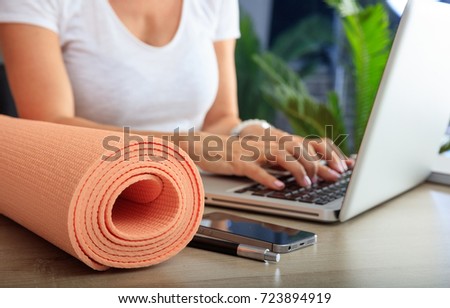 Relax at work concept. Yoga mat in an office desk