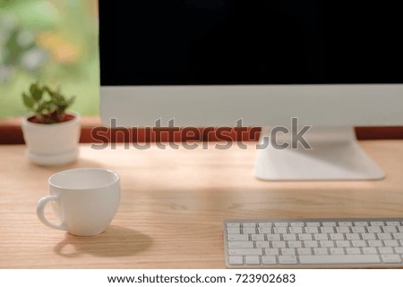 Coffee cup on office desk.