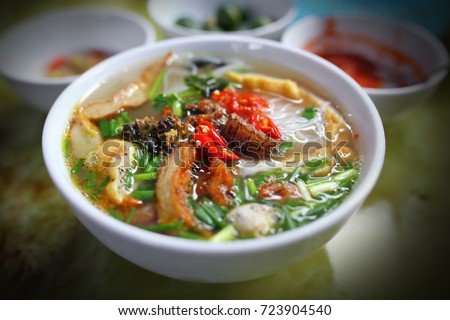 Bowl of Vietnamese rice noodles soup with Mantis shrimp Royalty-Free Stock Photo #723904540