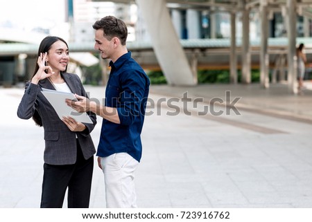 Sale woman trying to sell insurance to potential male client. Beautiful young sale woman trying hard to sell insurance to handsome young rich white male. Taken outdoor. Confident sale woman concept.