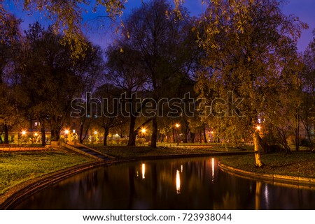 Dusk autumn view of park and pond in Yusupov Garden, Saint Petersburg, Russia