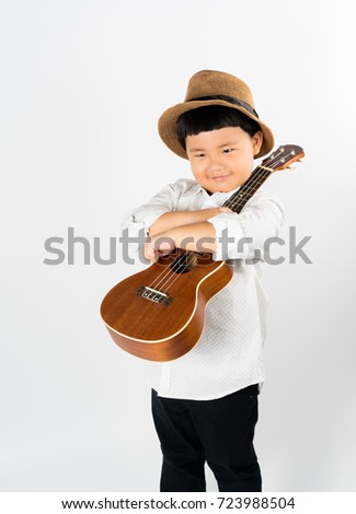 the isolated picture of a boy with ukulele