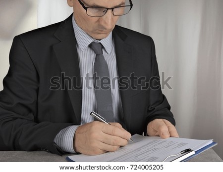 Business man signing  a contract making a deal, classic business concept
