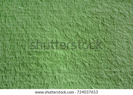 green seamless wool texture close up as a background.Towel Texture.Blurred background of soft tissue. green background of plush fabric
