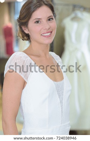 girl trying wedding dresses