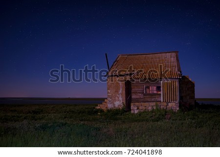 Night landscape with abandoned spooky house