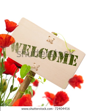 Welcome sign, wooden panel green plant and poppies - image is isolated on a white background