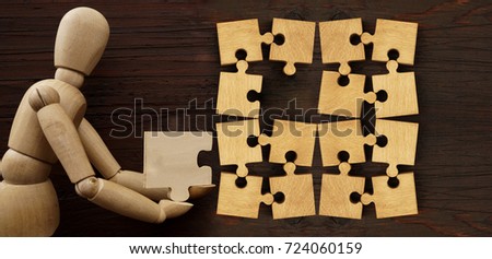 complete puzzles on wooden table texture. many, a lot Puzzles on  background. Lot of child puzzles laying on wooden floor. empty copy space for inscription or objects. missing,vacant place
