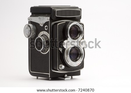 Old photo camera on white background
