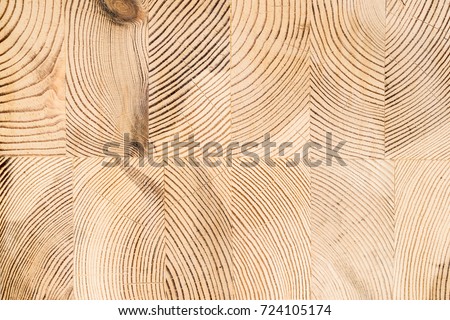 Wood structure background. Lumber industrial wood texture, timber butts background. Butt end of a processed wooden beam. Glued beams Royalty-Free Stock Photo #724105174
