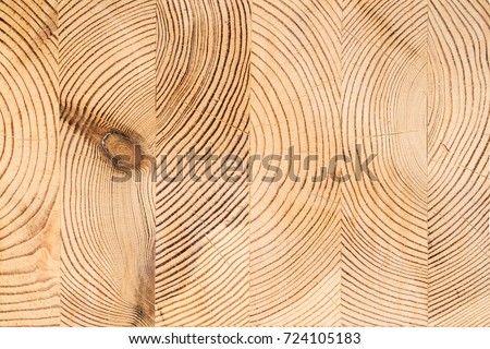 Wood structure background. Lumber industrial wood texture, timber butts background. Butt end of a processed wooden beam. Glued beams Royalty-Free Stock Photo #724105183