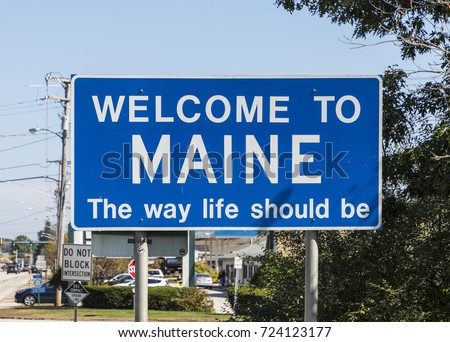state sign maine at the highway with welcome greeting