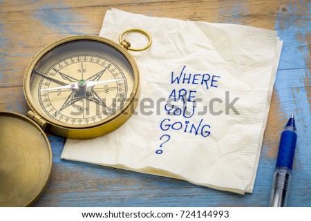 Where  are you going? -An essential question or searching for purpose  - a napkin doodle with a brass compass Royalty-Free Stock Photo #724144993