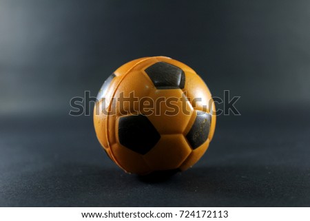 Football on the black floor