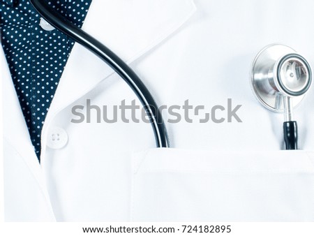  Close up of a stethoscope in a pocket of a doctor's white lab coat. 
