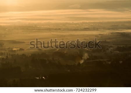 View sunrise from bird eye view above city or farm land , pollution in city 