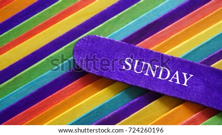 Concept colorful ice cream stick with word SUNDAY