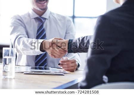 Business handshake in the office Royalty-Free Stock Photo #724281508