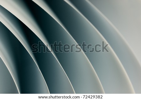background macro image of black and white origami pattern made of curved sheets of paper.